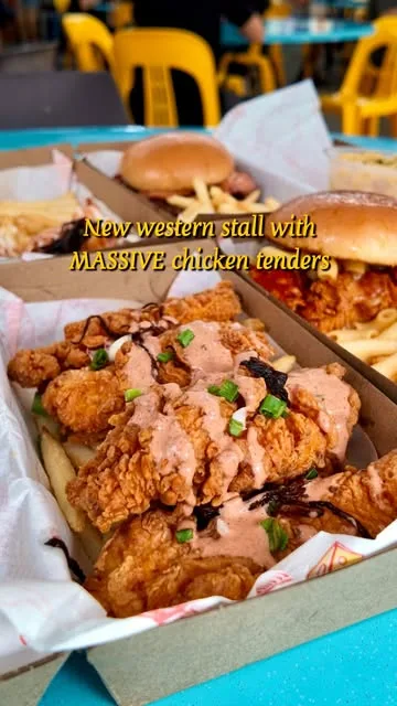 A spread of Last Bite Western takeaway boxes at the coffeeshop, loaded tenders in front, smash burgers behind